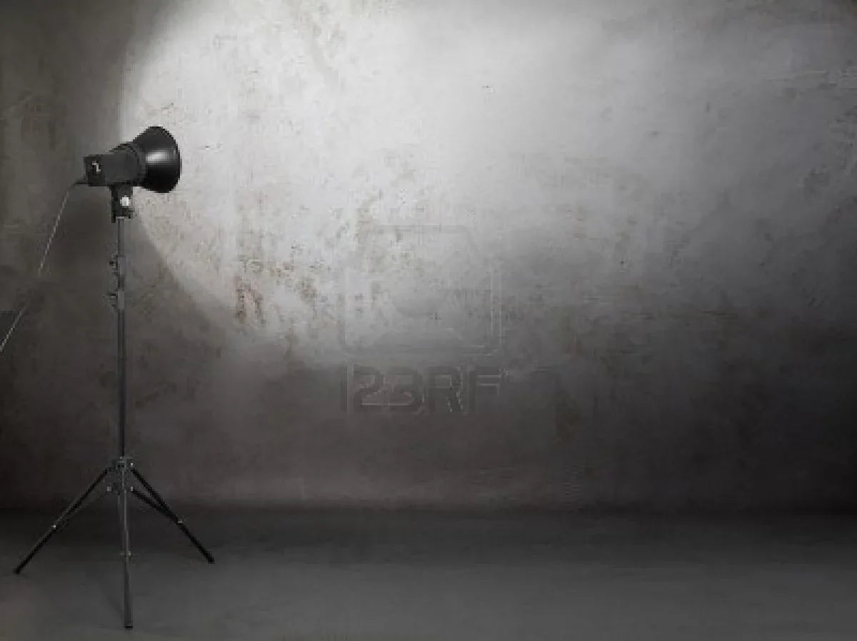 Top selling products image showcasing a minimalist photography studio setup with spotlight on a textured gray wall.