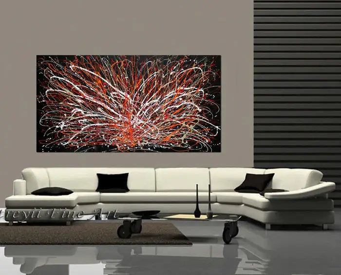 Jackson Pollock Art displayed above a modern sofa, showcasing vibrant colors and expressive drip painting.