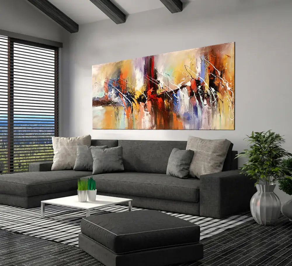 Hand-Painted Abstract Artwork displayed above a modern gray sofa in a stylish living room setting.