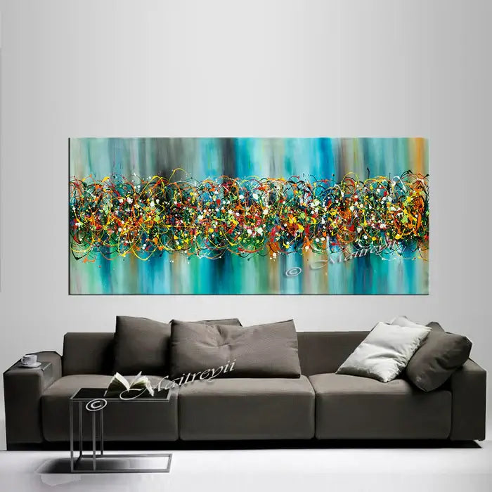 Extra large abstract art featuring vibrant colors in Jackson Pollock style, ideal as Ocean wall art above a modern couch.