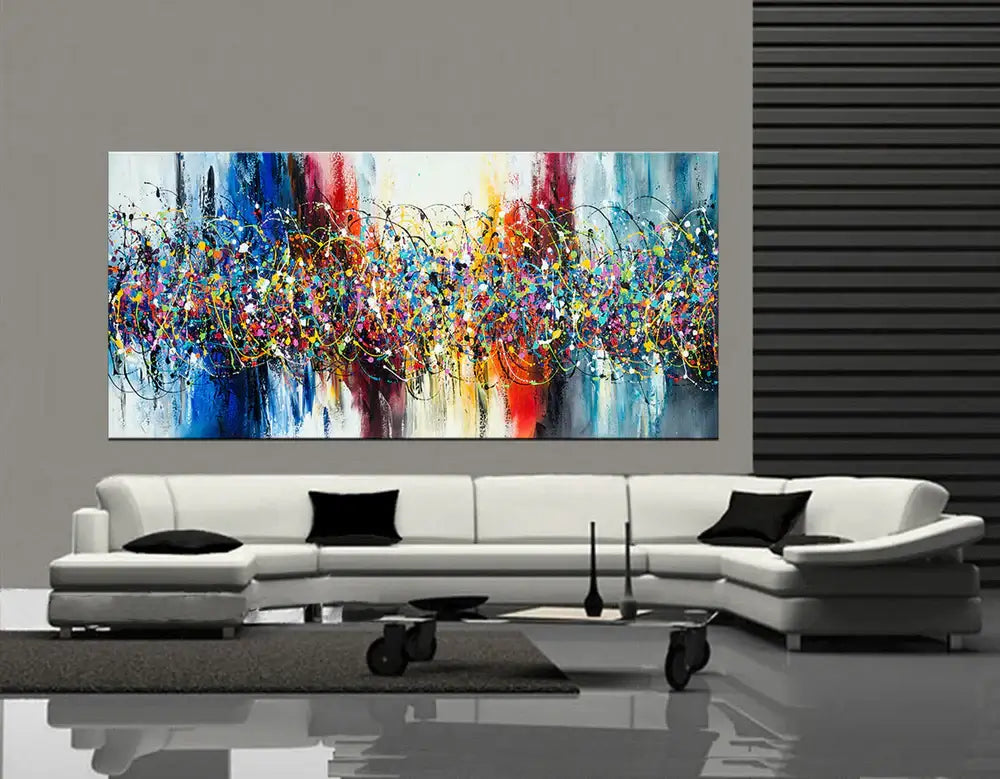 Abstract Angel Paintings displayed above a modern white sofa in a contemporary interior, showcasing vibrant colors.