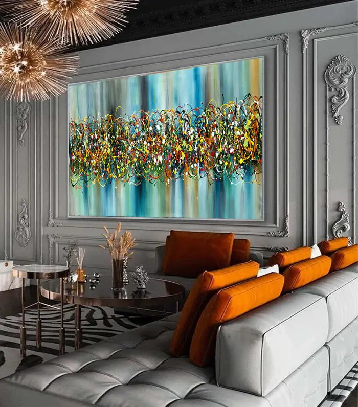 Extra large abstract painting in Jackson Pollock style, showcasing Ocean wall art above modern couch in a stylish interior.