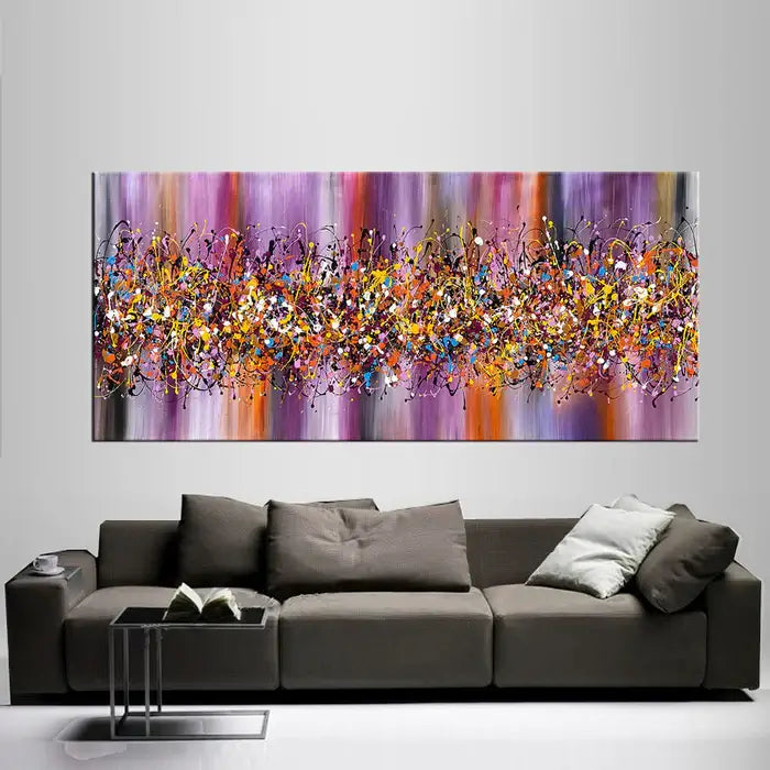 Drip Art Paintings by Maitreyii, vibrant abstract canvas artwork in a modern living room setting.