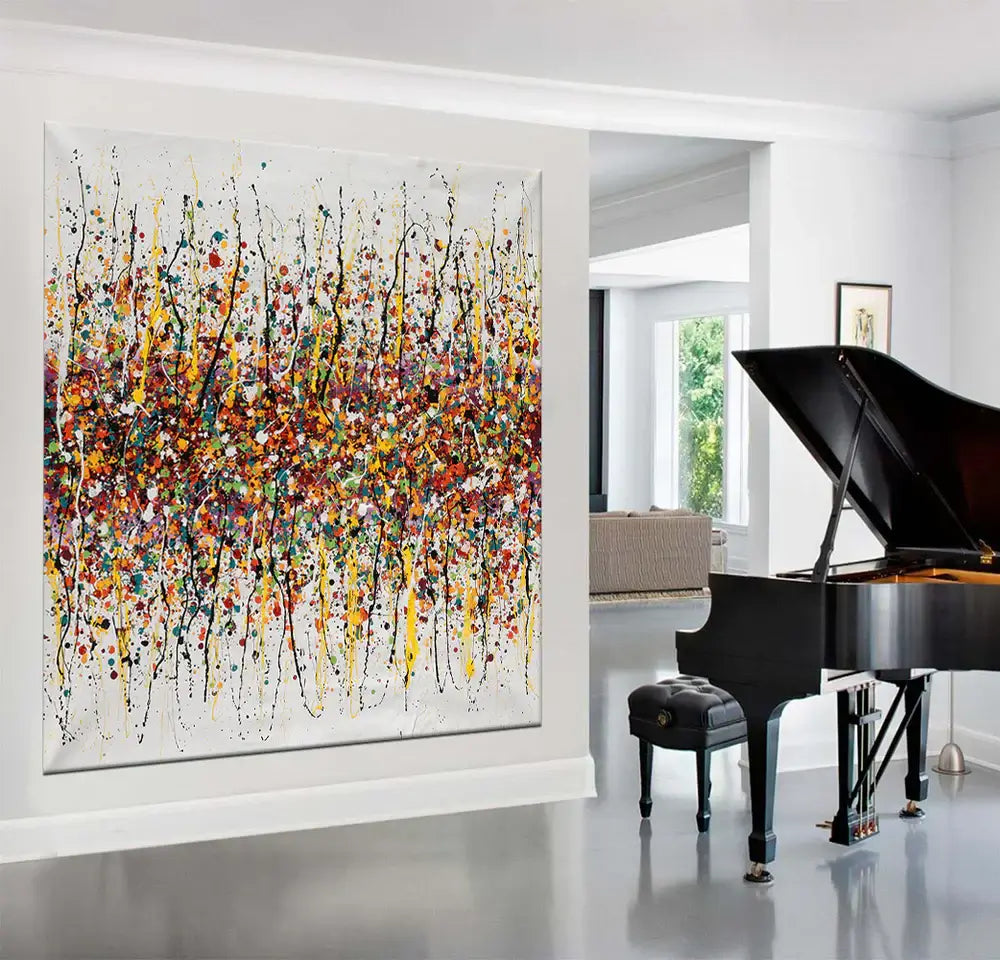 Splatter painting wall decor showcasing vibrant colors and dynamic patterns in a modern living space.