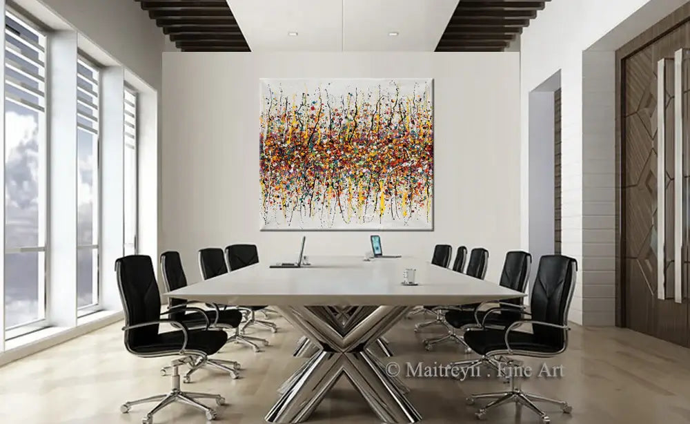 Splatter painting wall decor displayed in a modern conference room, featuring vibrant colors and dynamic patterns.