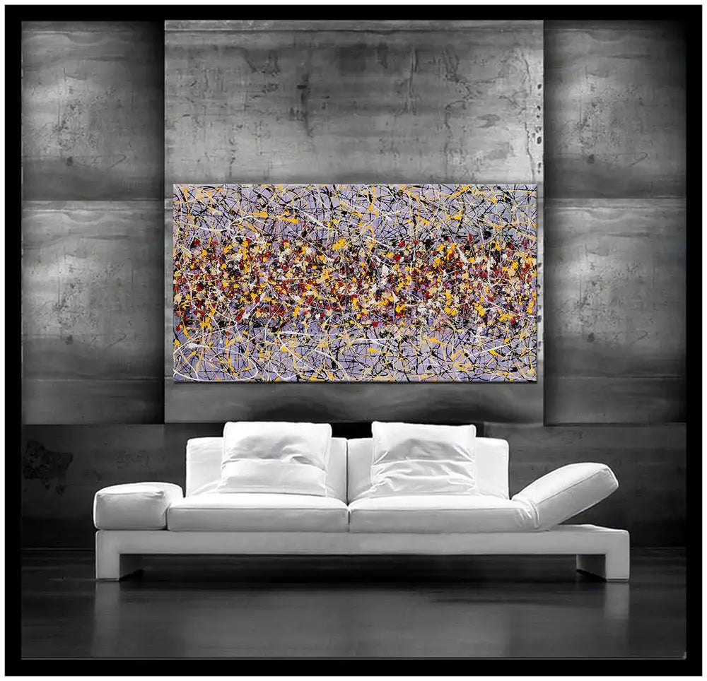 Action painting abstract art displayed in modern living room setting, showcasing vibrant patterns and colors.