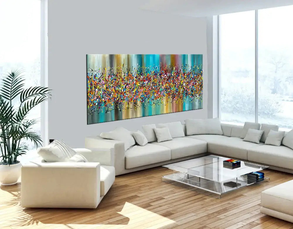 Painting Jackson Pollock Style showcased in a modern living room with a cozy white sofa and colorful abstract art on the wall.