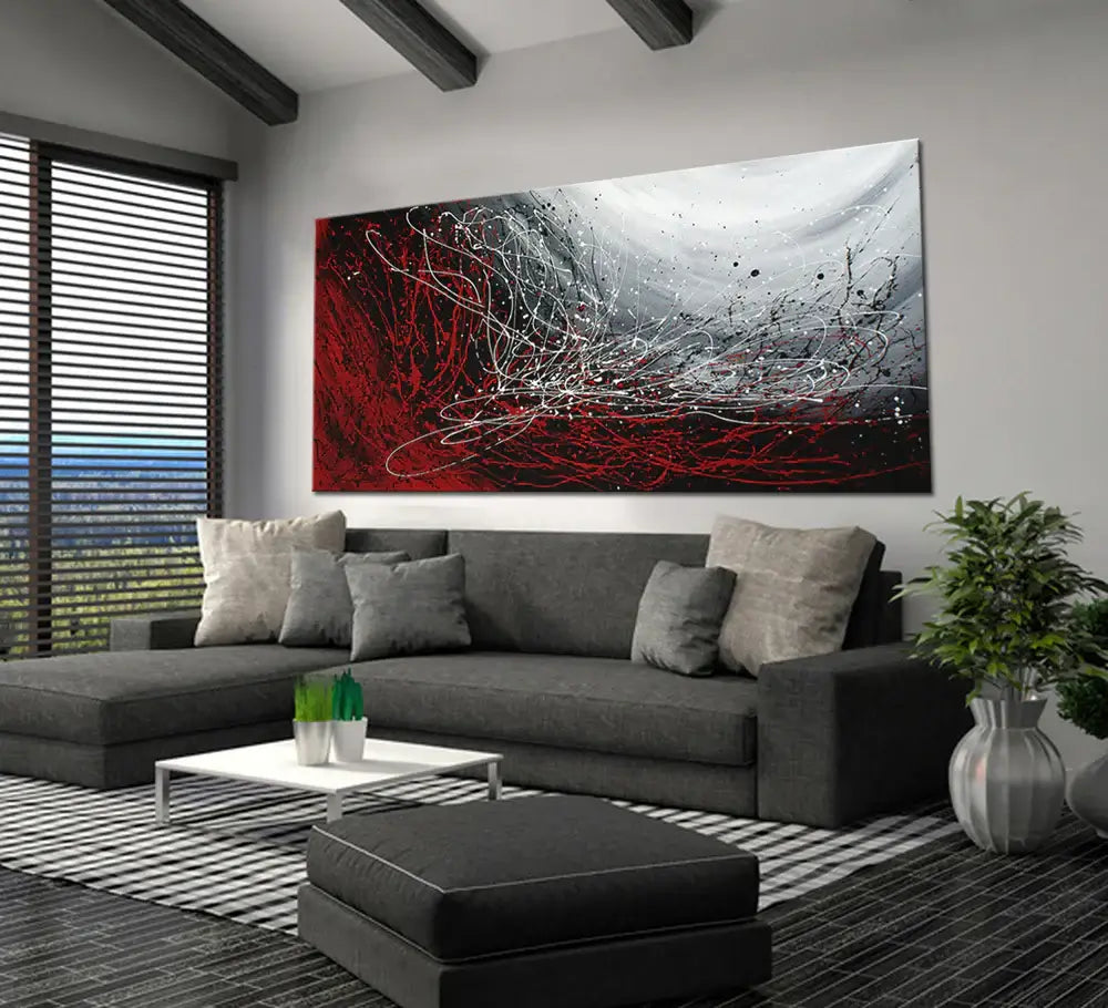 Original Pollock Style Artwork - Abstract drip painting featuring red and gray colors displayed in a modern living room.