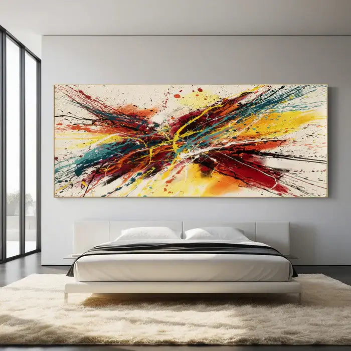 Abstract canvas painting featuring bold colors and dynamic splatters, perfect for modern home decor.