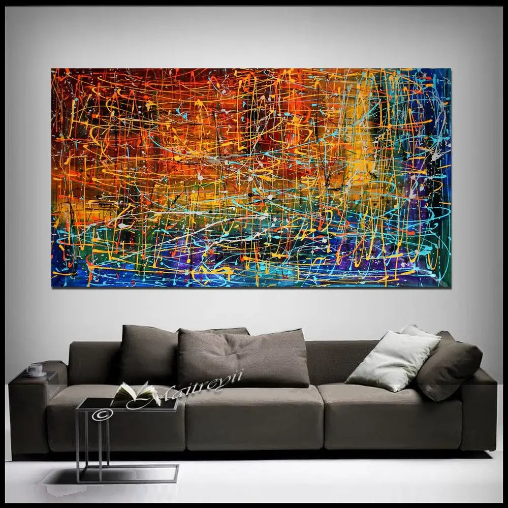 Drip Painting on Canvas | Hand-Painted Abstract Art - Embracing Fire displayed above a modern couch in a stylish living room.