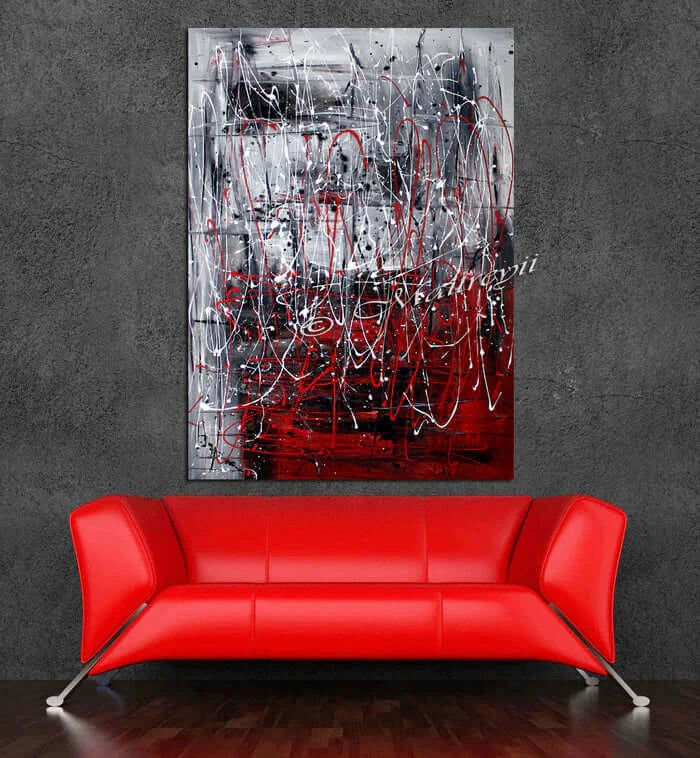 Red Painting Abstract large wall art displayed above a modern red sofa in a stylish interior setting.