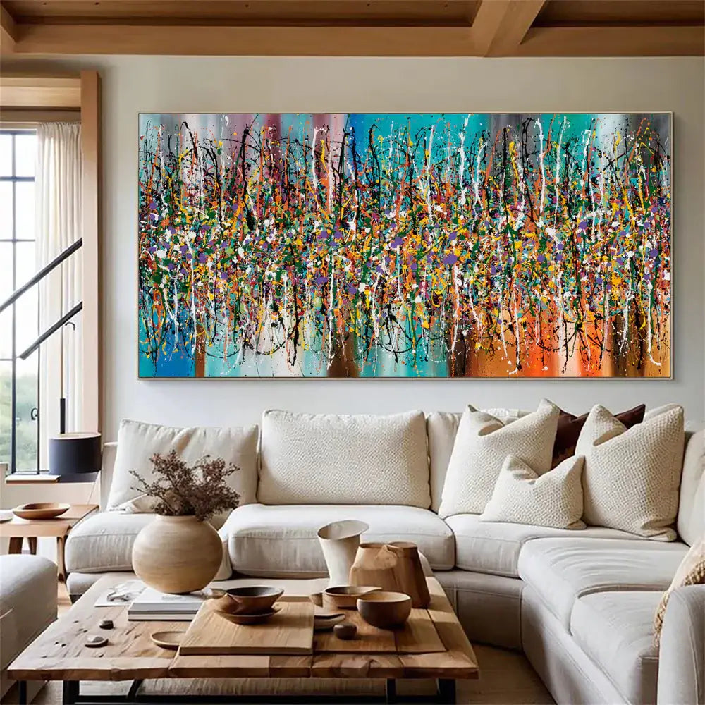Contemporary Abstract Drip Painting showcasing bold colors and textures in a modern living room setting.