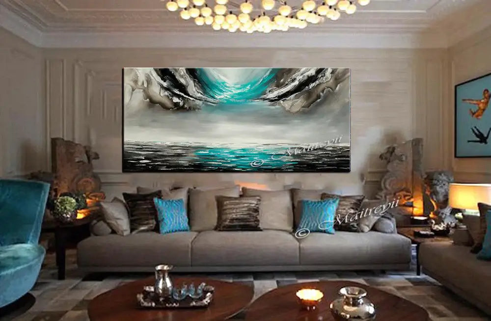 Large Ocean Art Teal Turquoise Paintings displayed in a stylish living room, enhancing the serene atmosphere.