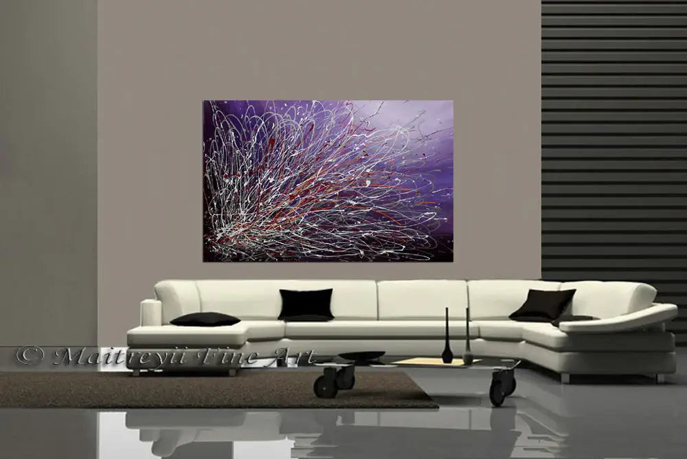 Purple Large Painting hanging on a wall above a modern white couch in a stylish living room.