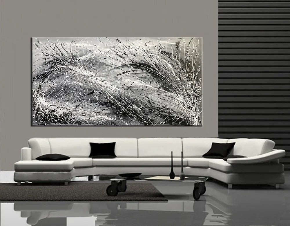 Alt Tag: Abstract Painting Drip Art black and white modern wall art canvas above white sectional sofa in contemporary living room
