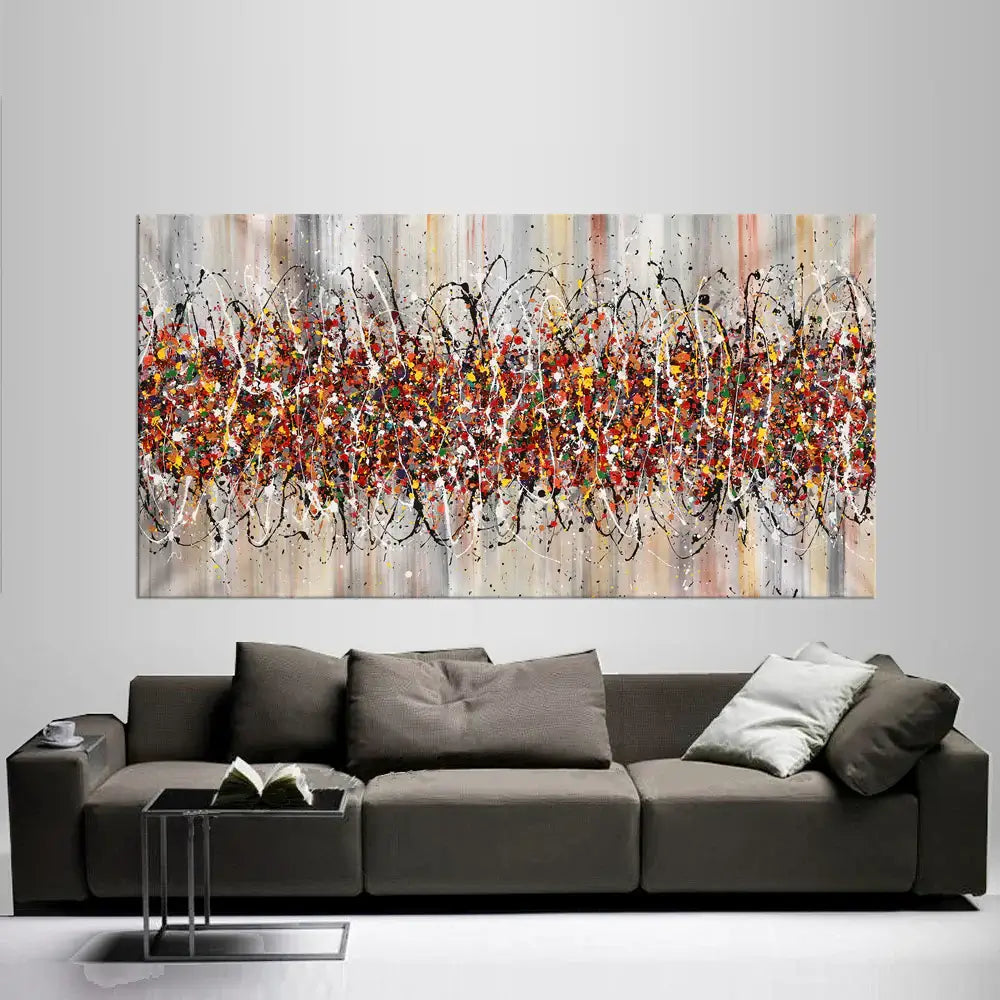 Jackson Pollock Style Painting – Drip Canvas Art above a modern gray sofa in a stylish living room.