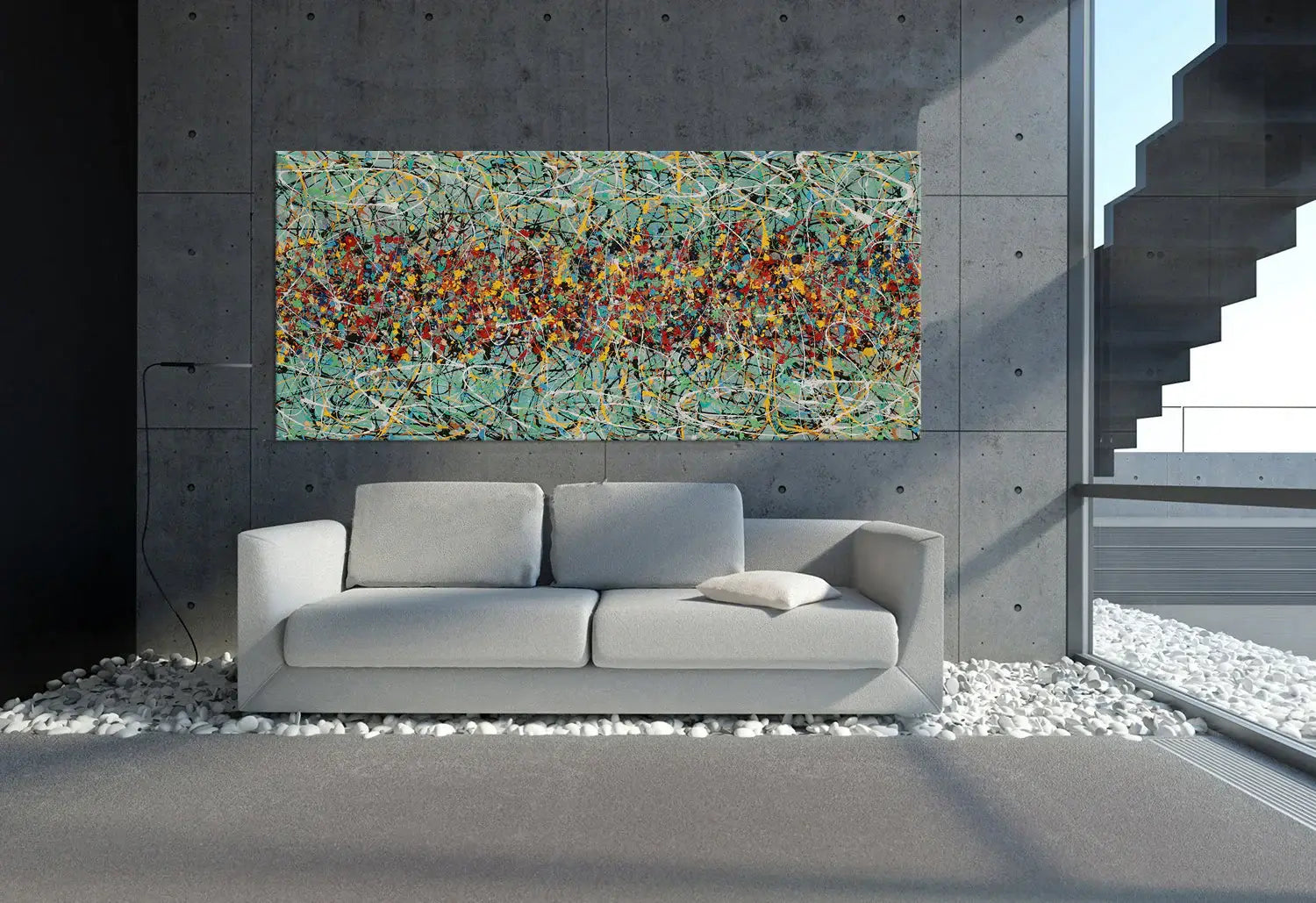Drip painting on canvas displayed above a modern gray sofa in a stylish living room interior.