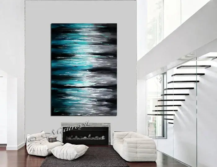Ocean Modern Wall Art Seascape Painting showcasing shades of teal, blue, and white in a contemporary living room.