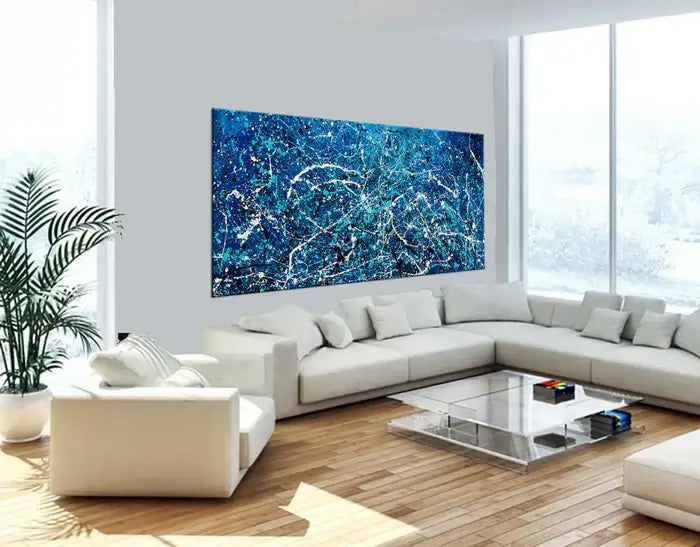 Abstract hand-painted canvas art in blue tones, enhancing the elegance of a modern living room design.