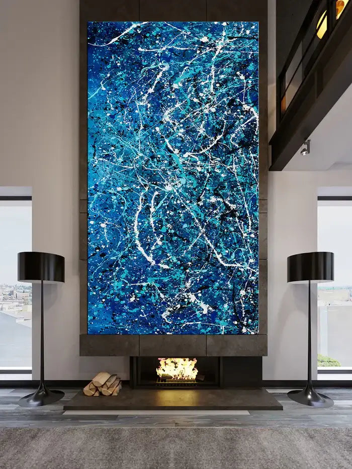 Abstract hand-painted art piece with vibrant blue textures adorning a modern dining room.