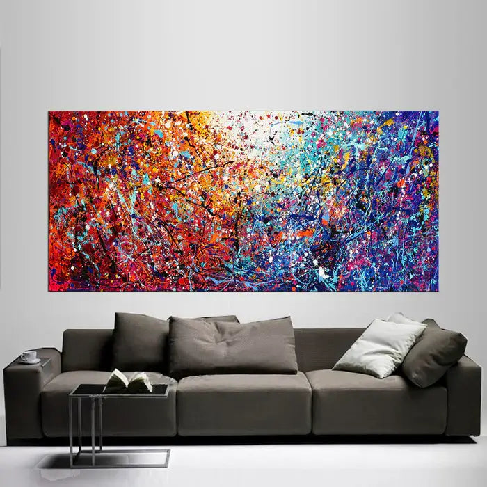 Jackson Pollock Red Painting displayed above a modern sofa, showcasing abstract drip art with vibrant colors and texture.