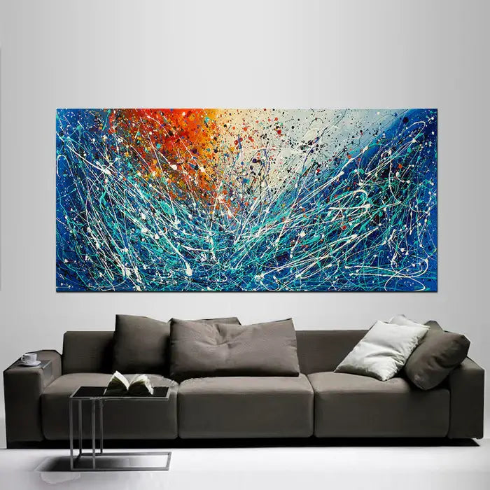 Geometric abstract art in vibrant colors above a modern sofa, enhancing a stylish living space.