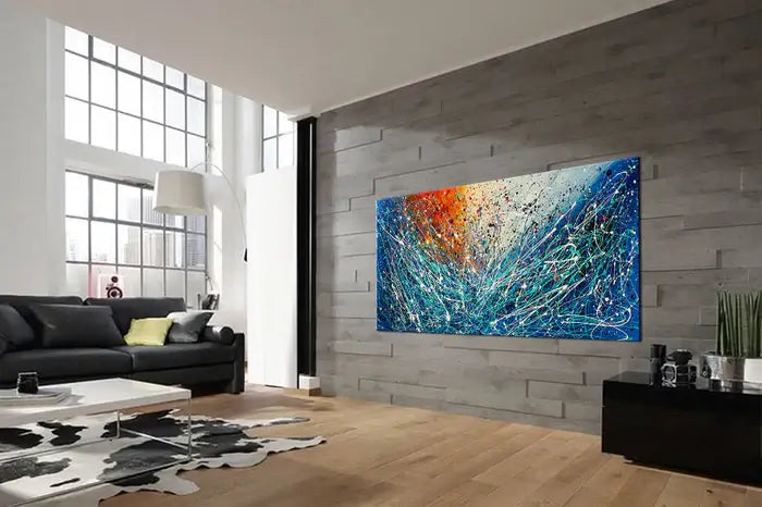 Modern hand-painted geometric abstract art in a stylish living room setting.