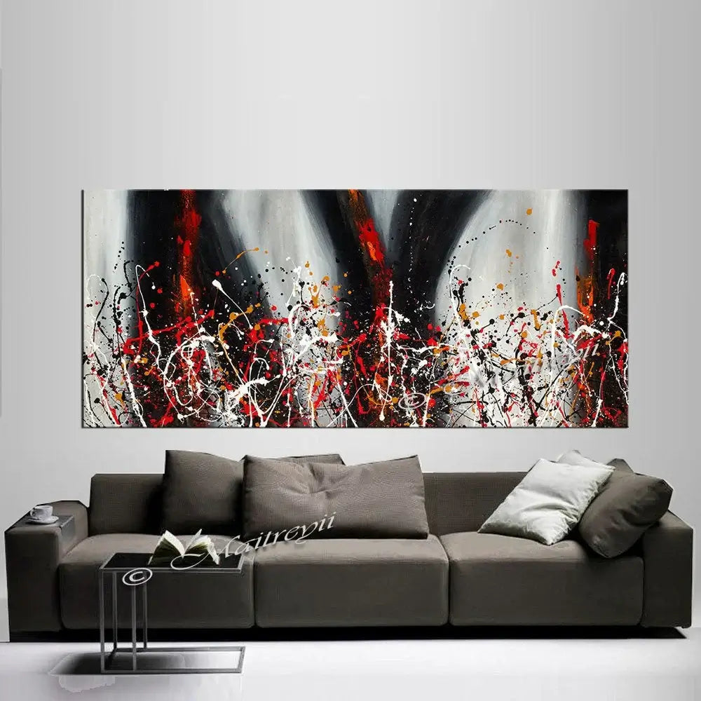 Painting Jackson Pollock Drip Style Abstract art displayed above a modern sofa, showcasing vibrant colors and textures.