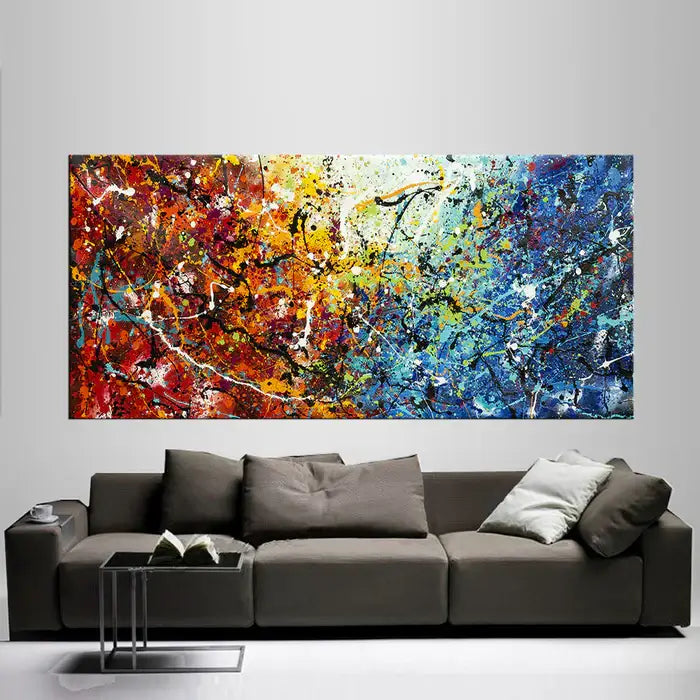 Abstract Jackson Pollock handmade drip painting on canvas above a modern sofa in a stylish interior.