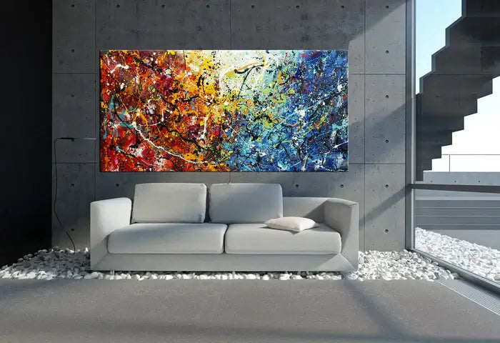 Abstract Jackson Pollock handmade drip painting displayed above a modern sofa in a stylish interior setting.