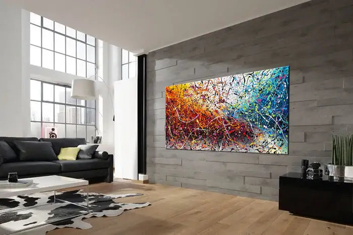 Painting Jackson Pollock Multiple Size displayed in modern living room, featuring vibrant colors and abstract drip art.