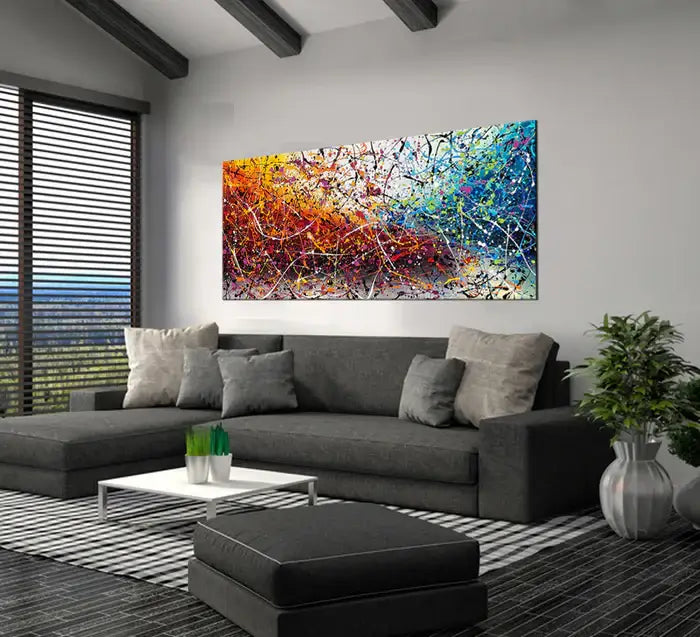 Painting Jackson Pollock Multiple Size hanging in a modern living room above a gray sofa with decorative pillows.