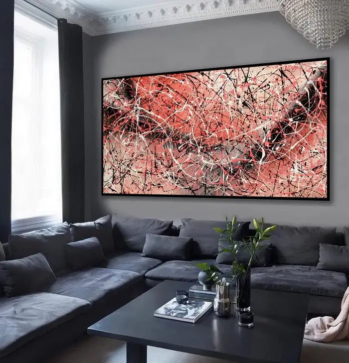 Jackson Pollock Painting displayed in a modern living room with gray furniture and minimalist decor.