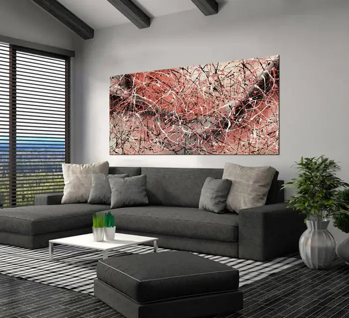 Jackson Pollock Painting displayed in a modern living room setting with grey sofa and natural light.