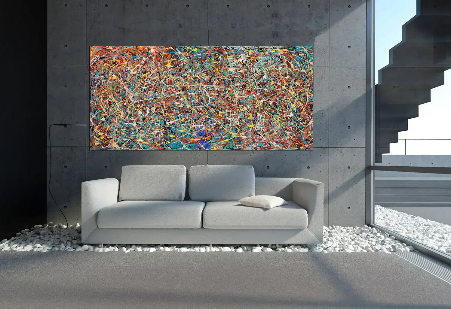 Modern splatter art painting displayed over a modern sofa in a contemporary living room setting.