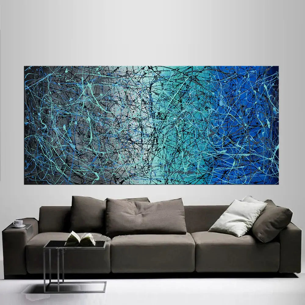 Pollock Inspired Wall Art features bold splatter and drip painting above a stylish sofa, showcasing original abstract beauty.