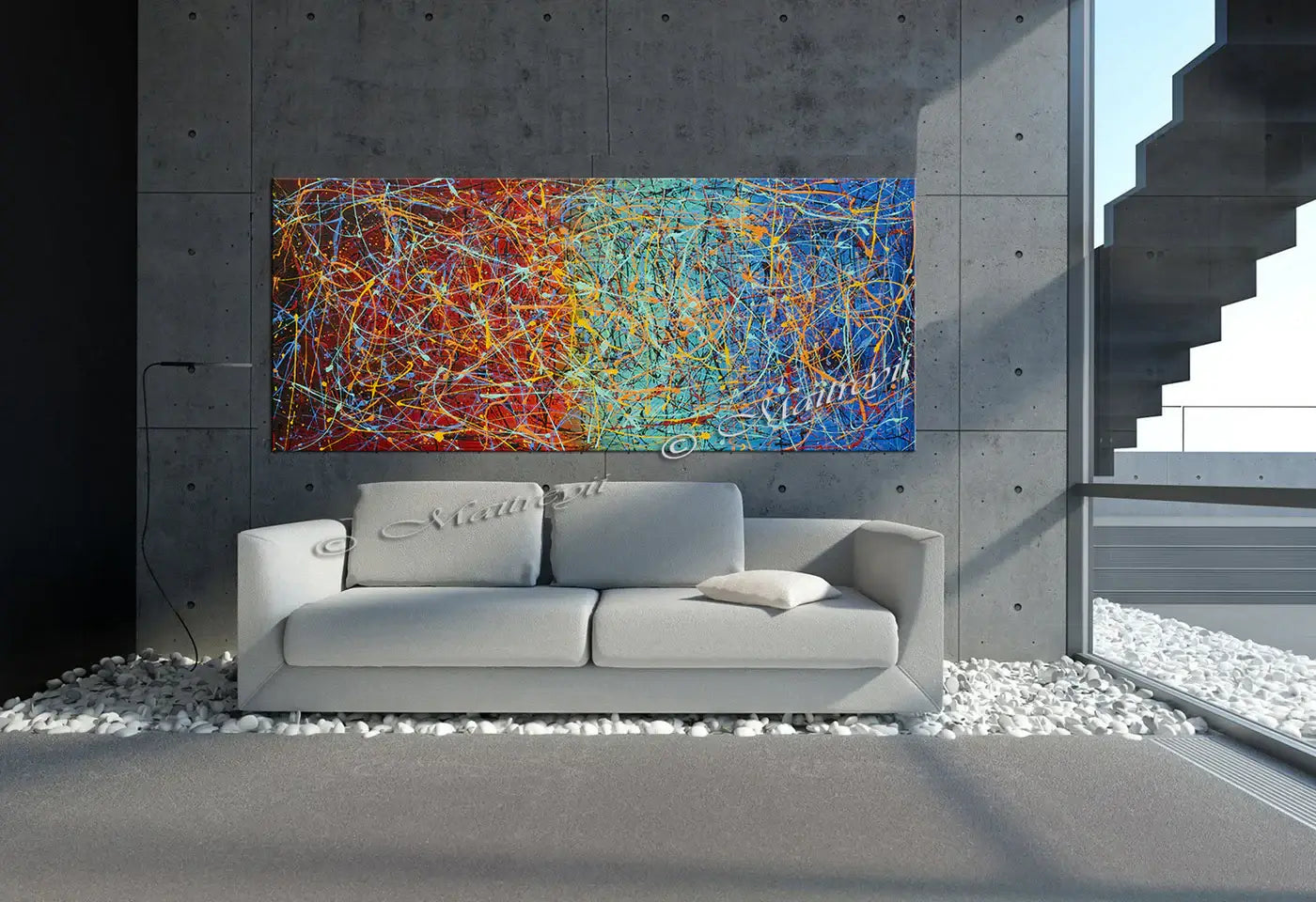 Jackson Pollock Style abstract canvas wall art displayed in a modern living room with a gray sofa and stone wall.