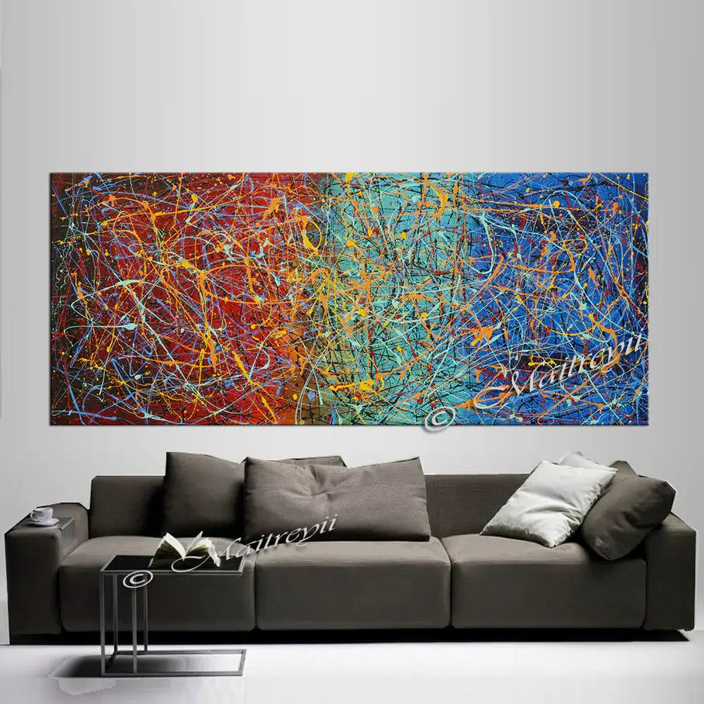 Jackson Pollock Style | Abstract Canvas Wall Art displayed above a modern gray sofa in a stylish interior setting.