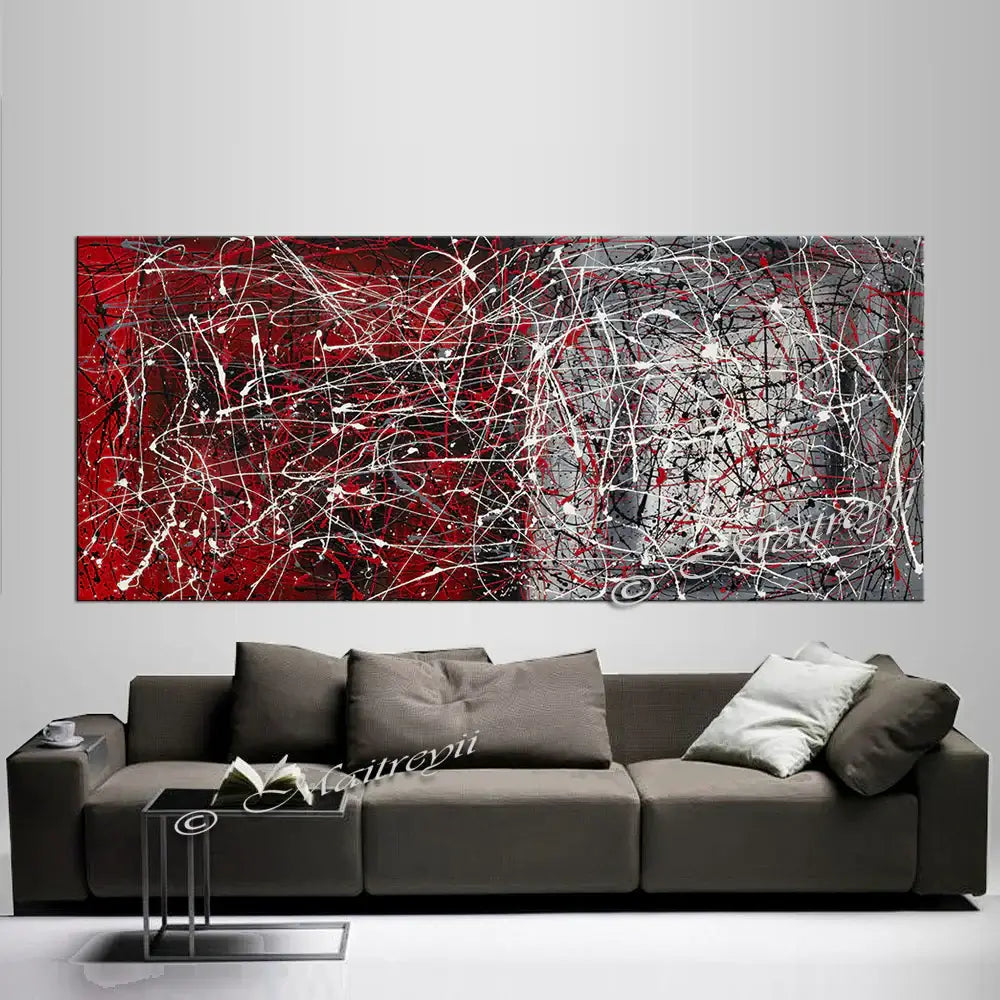 Jackson Pollock Style | Abstract art drip painting on a wall above a modern sofa in a stylish living room