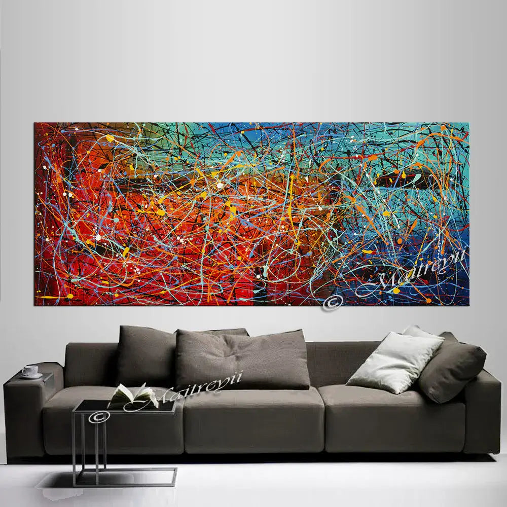 Jackson Pollock Style | Abstract Canvas Wall Art on modern couch, showcasing vibrant colors and dynamic patterns.
