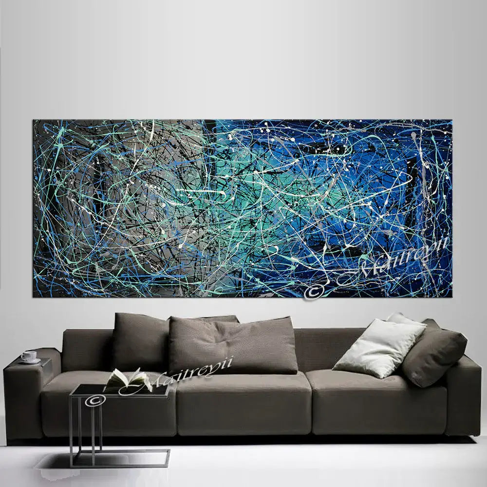 Jackson Pollock Style abstract canvas wall art displayed above a modern sofa in a stylish living room.