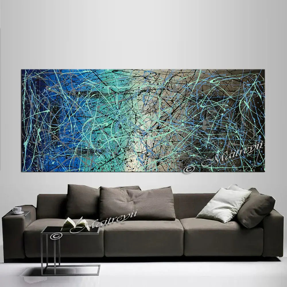 Jackson Pollock Style abstract wall art above a modern sofa, showcasing vibrant colors and dynamic designs.