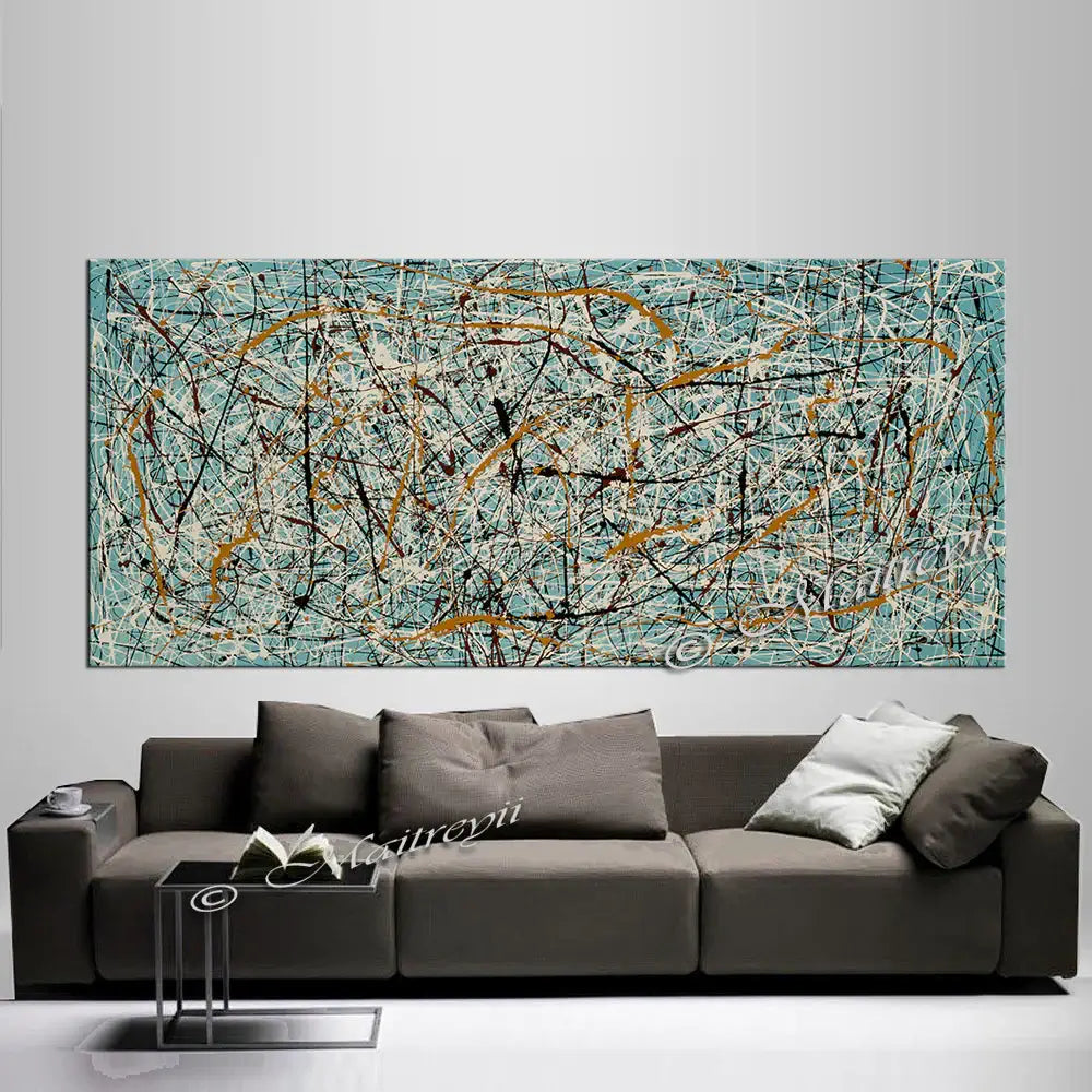Jackson Pollock Style Art displayed above a modern sofa in a luxury home interior.