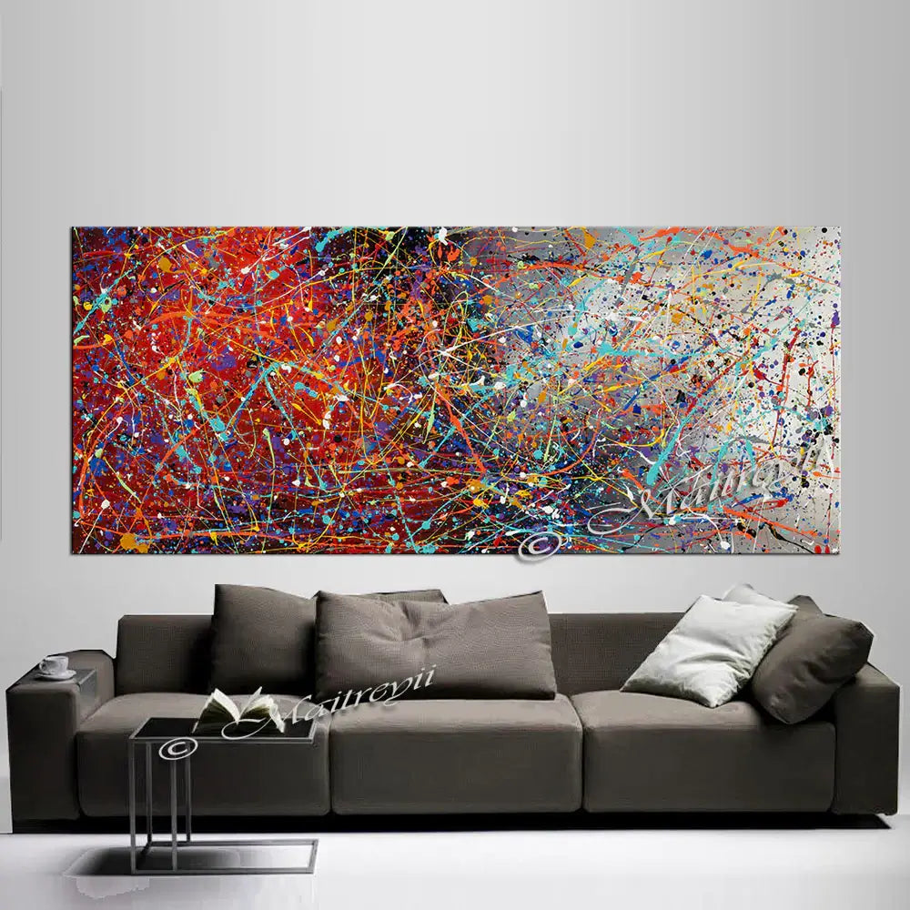 Jackson Pollock Style large painting displayed above a modern sofa in a luxury home setting.