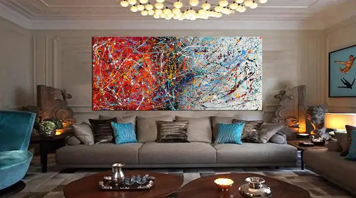 Modern abstract wall decor featuring hand-painted canvas art in vibrant colors, enhancing a stylish living room.