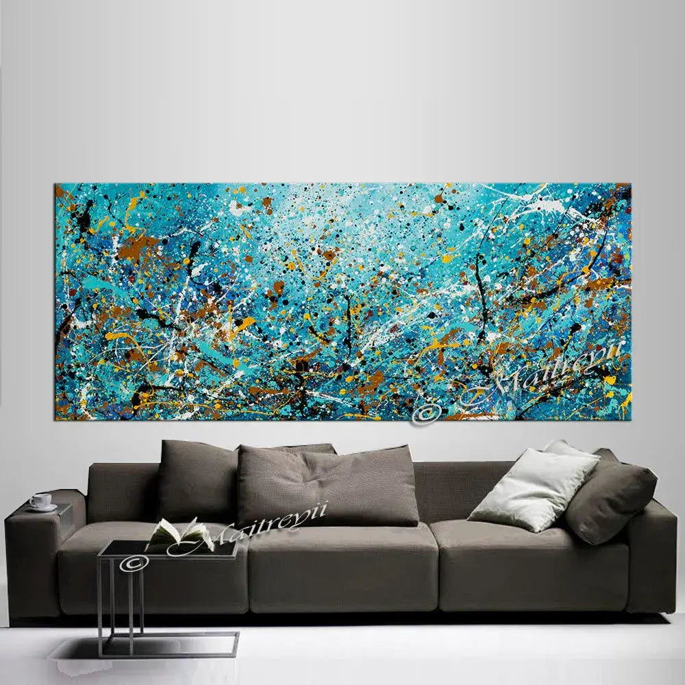 Abstract art on canvas above a modern sofa, showcasing bold colors and textures in hand-painted design
