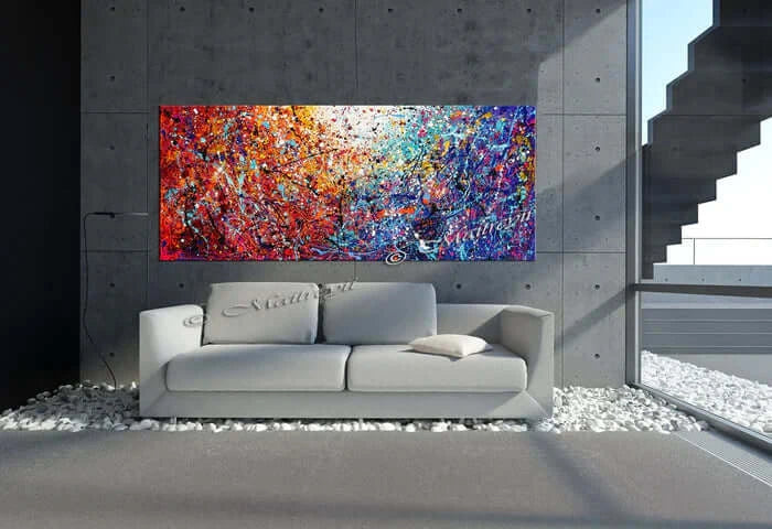 Painted abstract art displayed in a modern interior, showcasing bold colors and textures on a handcrafted canvas.