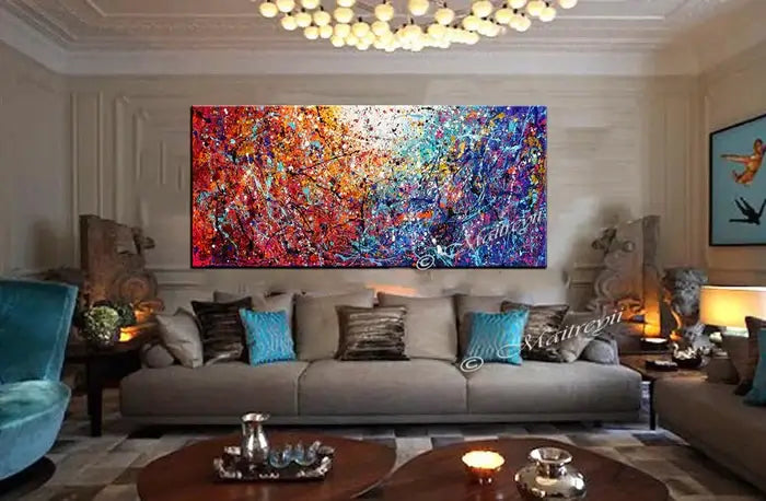 Painted abstract art displayed in a modern living room, featuring bold colors and textures on a handcrafted canvas.
