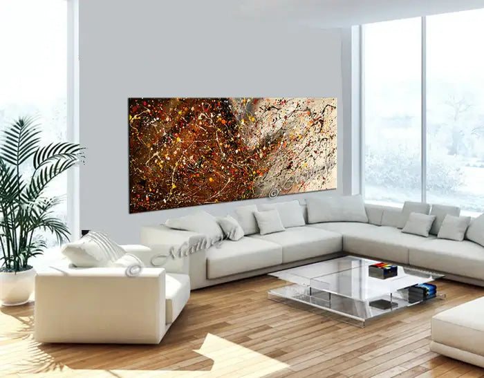 Abstract canvas painting in a modern living room, showcasing vibrant colors and dynamic textures on the wall.
