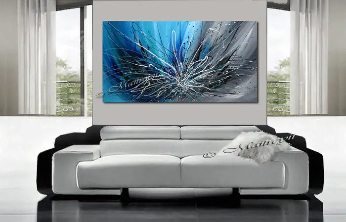 Abstract Art Blue Wall Art Large Painting on Canvas featuring winter blossom in serene blue tones over a modern living room sofa.